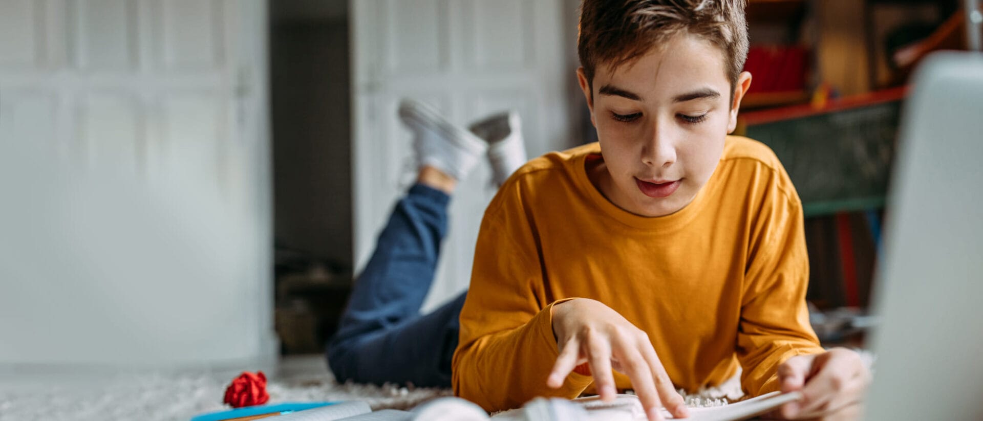 boy studying with his notebook