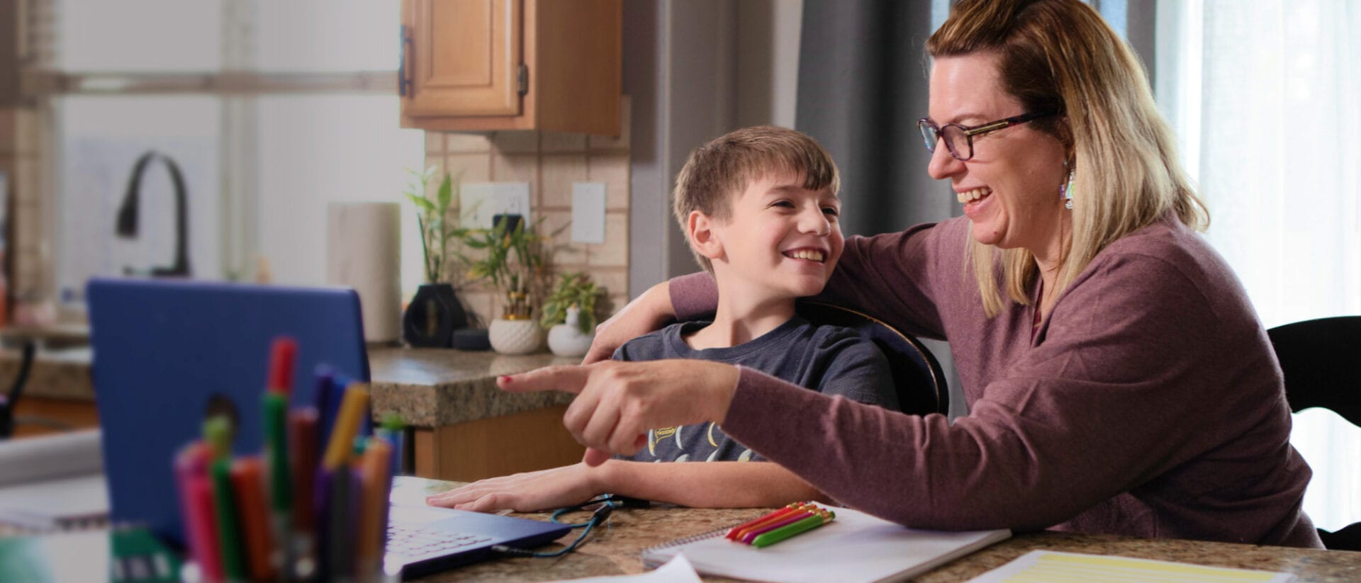 mom and little boy smiling