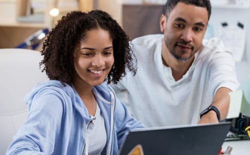 woman and man working in the computer